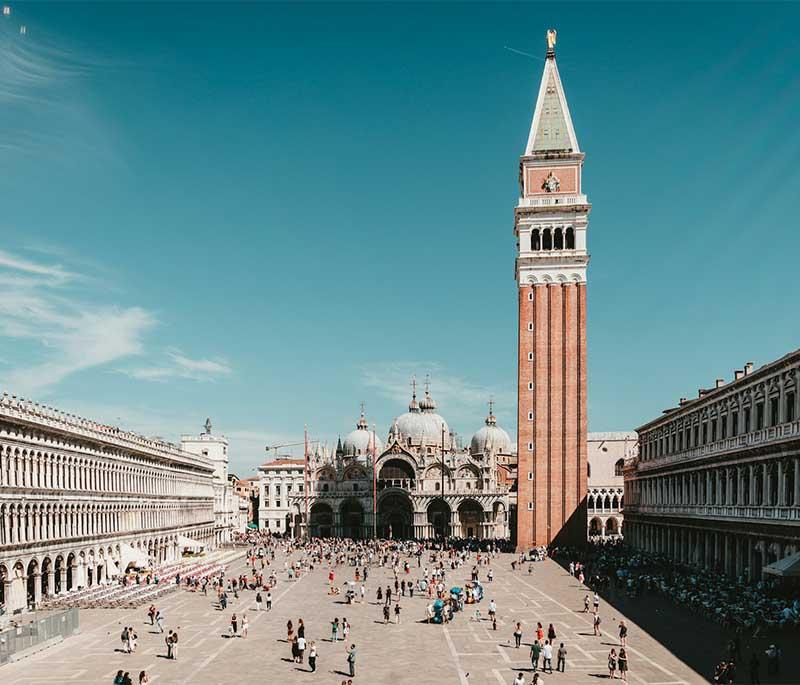 Piazza San Marco,the main square in Venice, surrounded by historic buildings including St. Mark's Basilica and the Campanile.