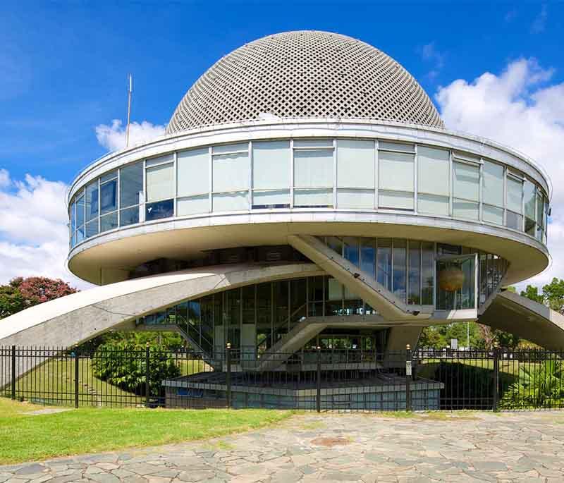 Planetario Galileo Galilei in Buenos Aires: Distinct dome structure and surrounding green spaces make it a unique attraction.