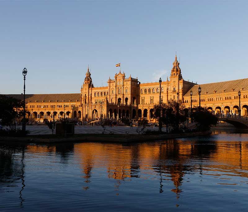 Plaza de España (Seville) - A grand plaza with a semicircular building, bridges, and beautiful tile work, in Maria Luisa Park