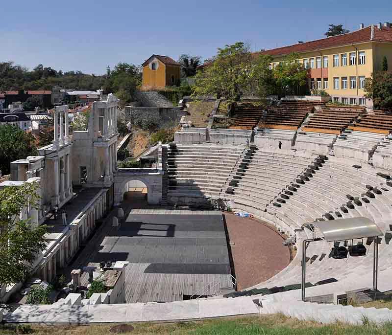 Plovdiv, famous for its ancient Roman amphitheater and well-preserved old town with cobblestone streets.