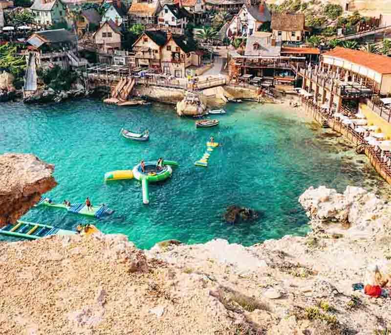 Popeye Village, originally a film set, has been transformed into a fun theme park attracting families and film enthusiasts.