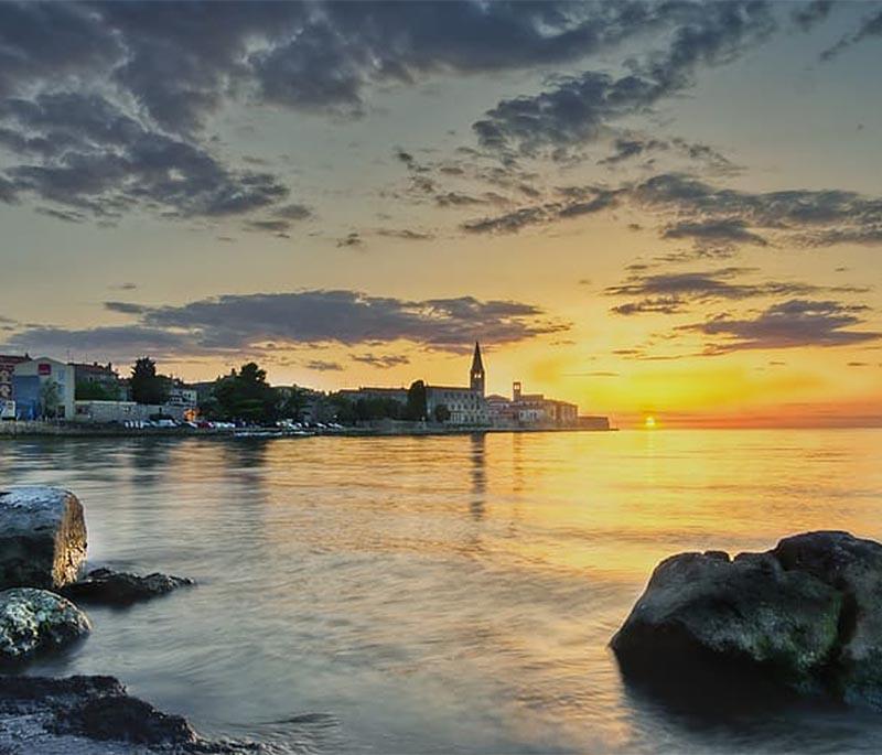 Poreč, known for the UNESCO-listed Euphrasian Basilica, charming old town, beautiful beaches, and cultural heritage.