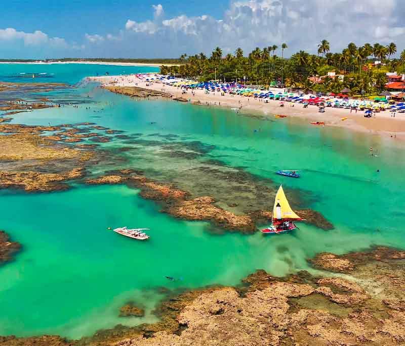 Porto de Galinhas, a beautiful beach destination known for its clear waters, natural pools, and vibrant marine life.