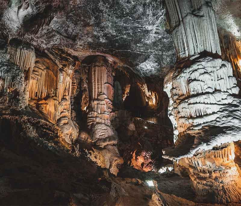 Postojna Cave - One of the largest karst cave systems in the world, featuring stunning formations and a cave train.