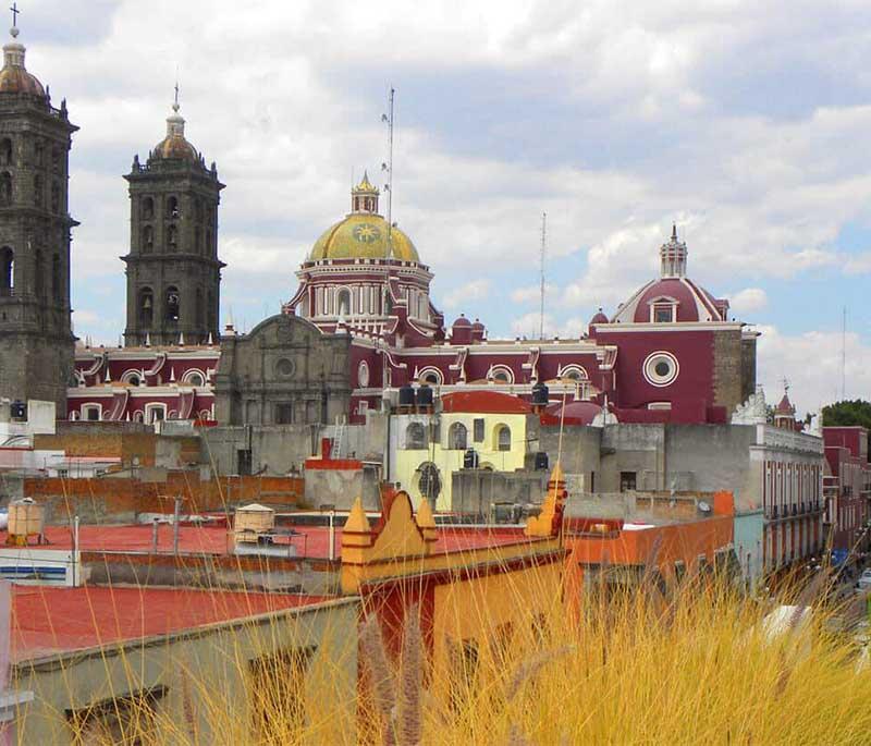 Puebla City, Puebla: Known for its culinary heritage, including mole poblano, and beautifully tiled colonial buildings.