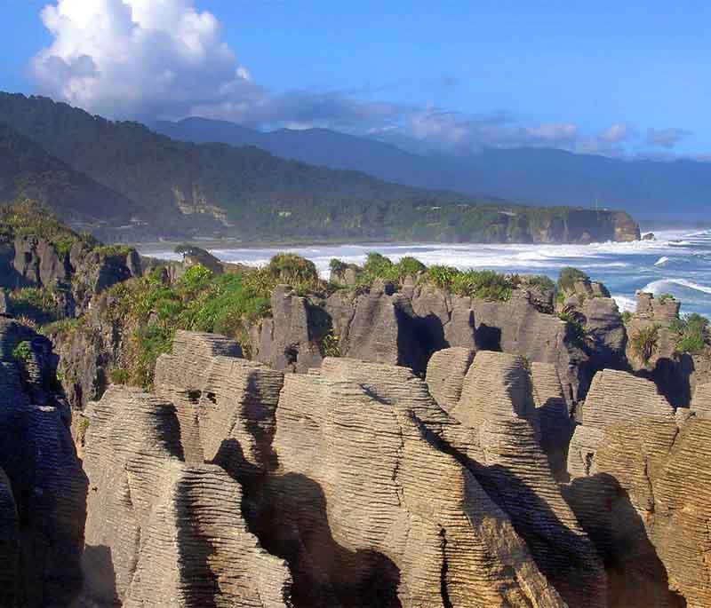 Punakaiki Pancake Rocks, West Coast - Unique limestone formations resembling stacked pancakes, with impressive blowholes.