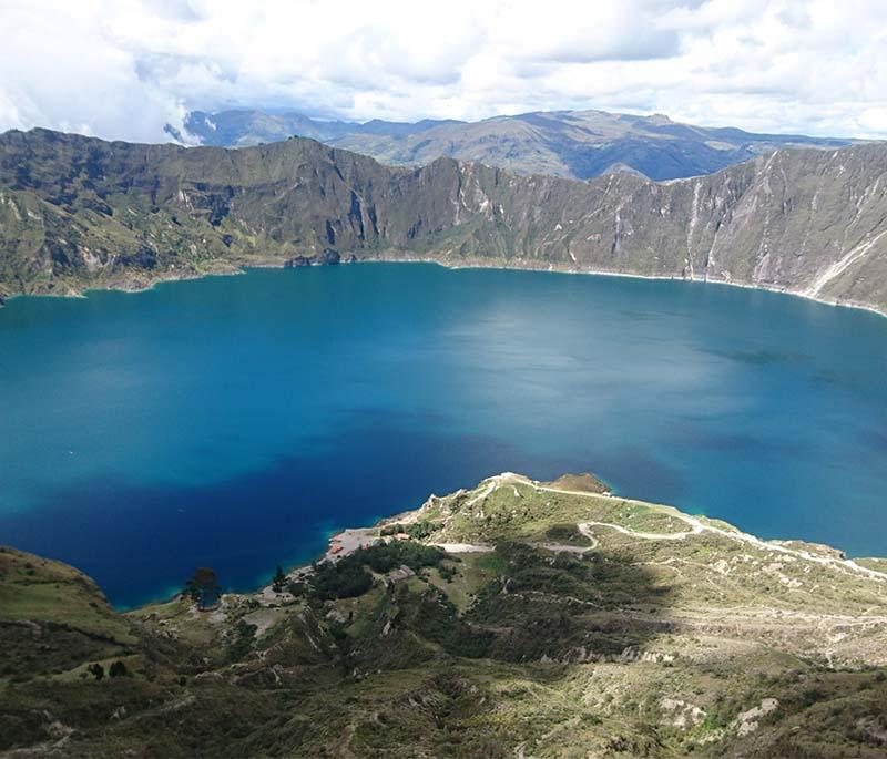 Quilotoa Crater Lake, a beautiful turquoise volcanic lake with hiking trails offering breathtaking views.