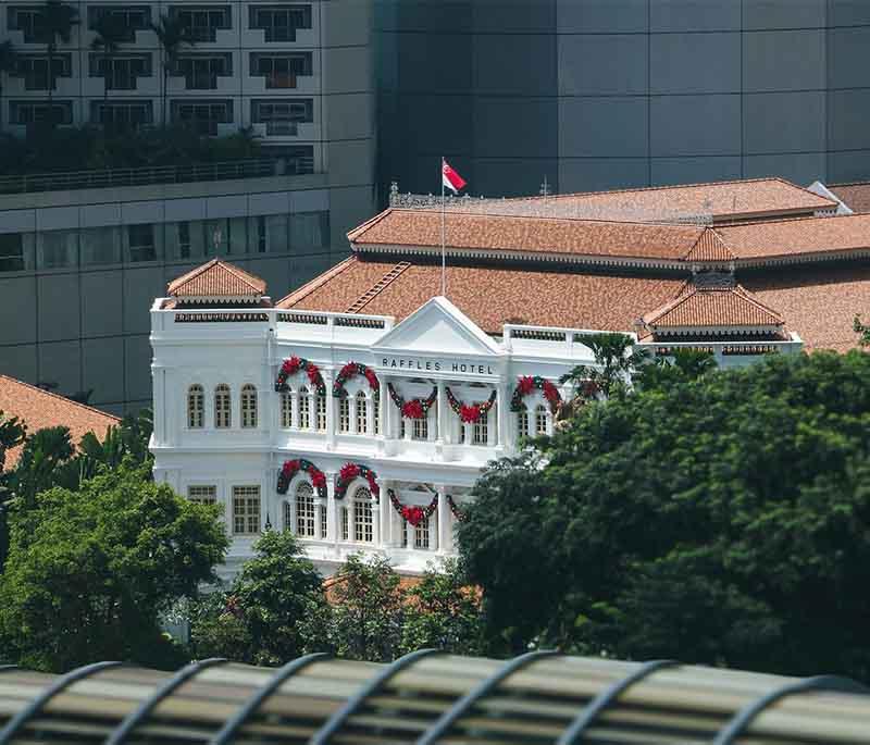 Raffles Hotel - A historic luxury hotel known for its colonial architecture and the iconic Singapore Sling cocktail.