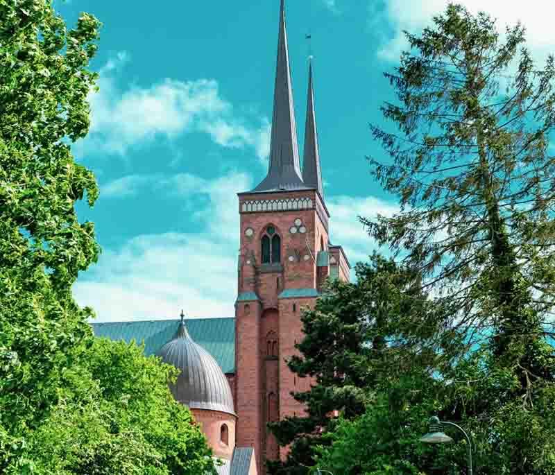 Roskilde Cathedral, a UNESCO site and the burial place of Danish monarchs, known for its impressive Gothic architecture.