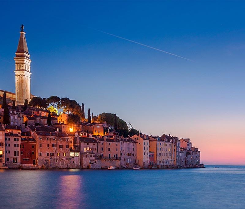 Rovinj, a picturesque coastal town with charming cobblestone streets, colorful buildings, and a scenic harbor.