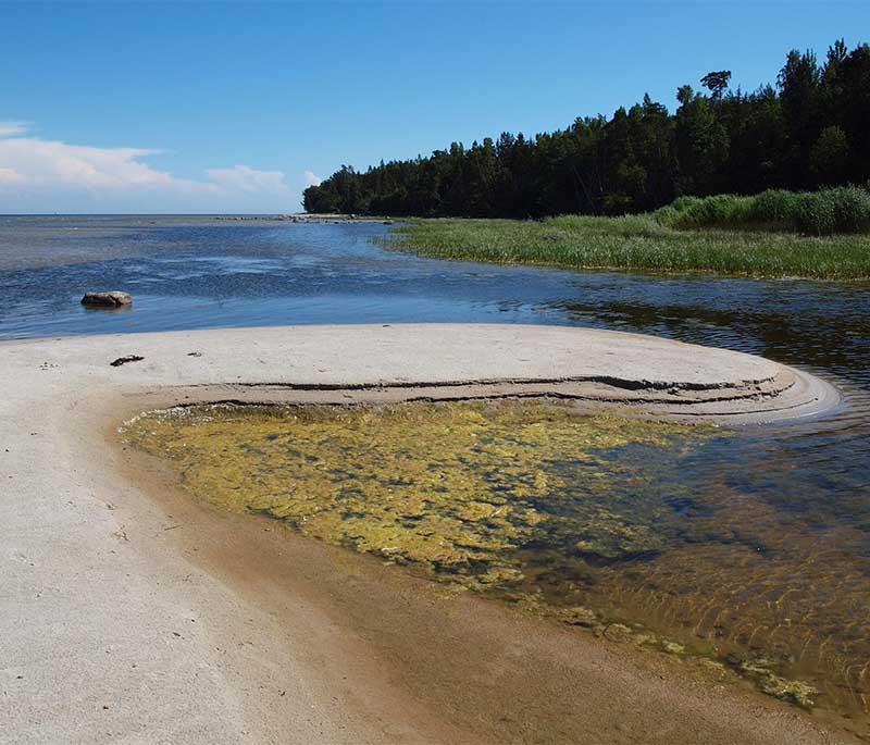 Ruhnu Island, a remote island in the Gulf of Riga known for its unique cultural heritage, wooden church, and lighthouse.