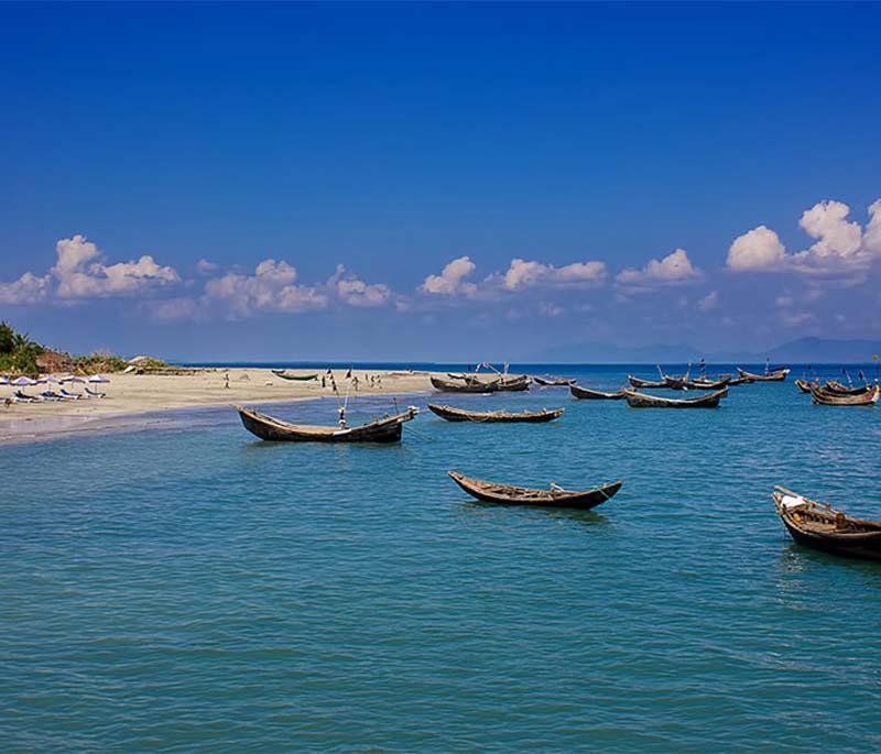 Saint Martin's Island, depicting a serene coral island with crystal-clear waters and white sandy beaches.