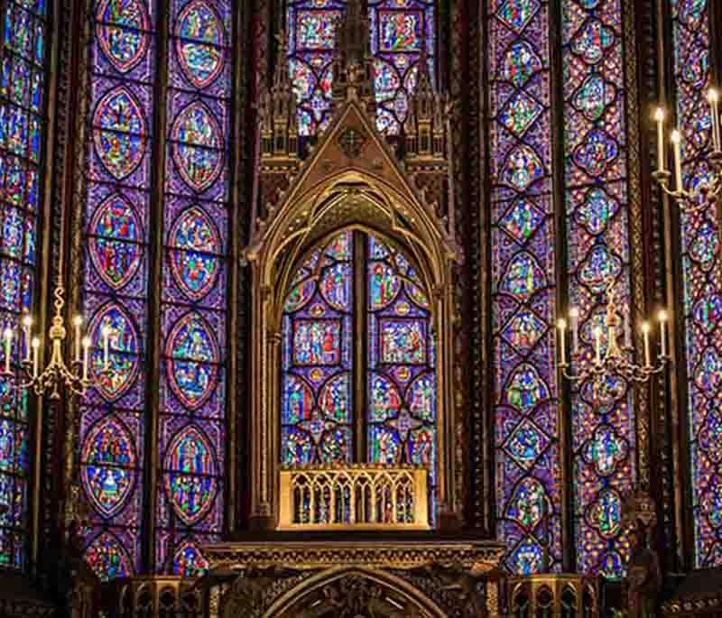 Sainte-Chapelle, Paris, a Gothic chapel known for its stunning stained glass windows depicting biblical scenes.