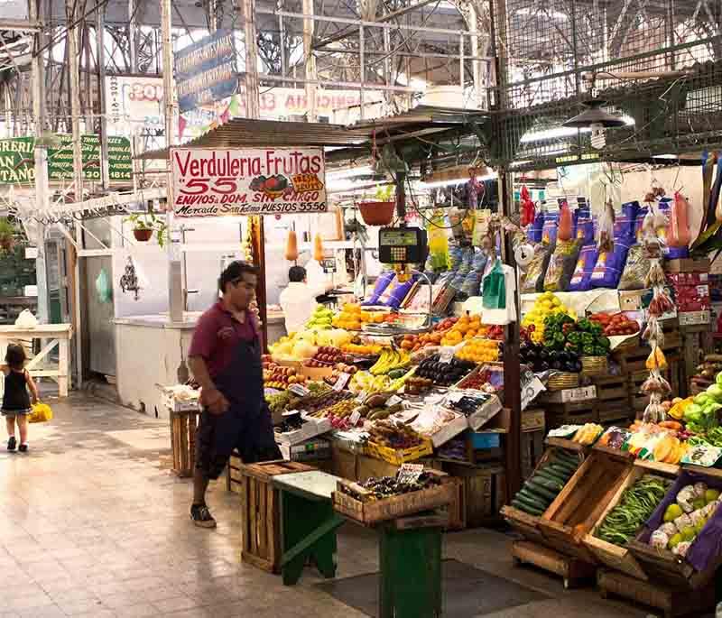 San Telmo Market in Buenos Aires, featuring a lively market scene with antique stalls, local crafts, and traditional food.