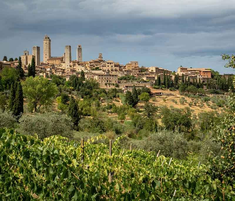 San Gimignano, Tuscany, a medieval hill town known for its well-preserved towers, historic buildings, and beautiful scenery.