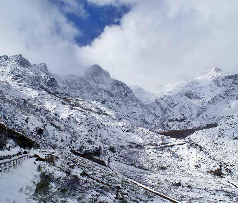 Serra da Estrela - The highest mountain range in mainland Portugal, offering hiking, skiing, and stunning natural landscapes.