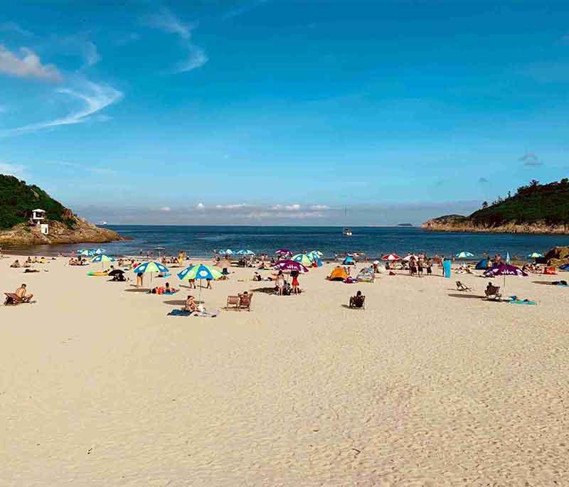 Shek O Beach in Hong Kong, a popular beach with calm waters, perfect for swimming, sunbathing, and scenic views.