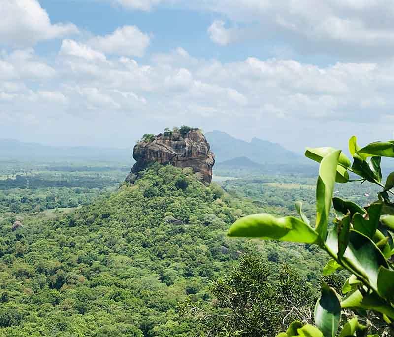 Sigiriya Rock Fortress - Ancient rock fortress, UNESCO World Heritage site, famous for frescoes and gardens.