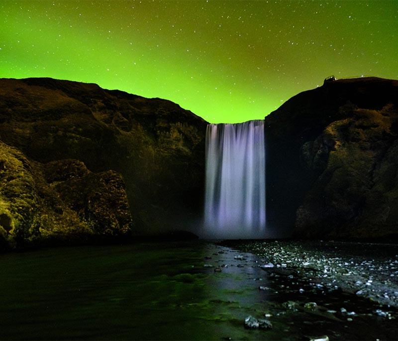 Skogafoss Waterfall, a stunning waterfall with a drop of 60 meters, offering scenic views and hiking opportunities.