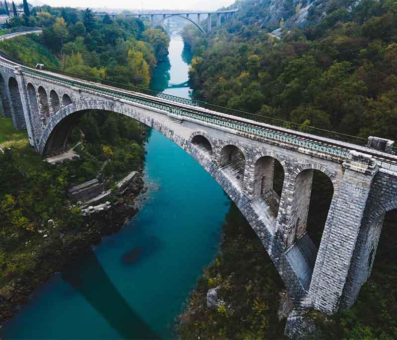 Solkan Bridge - A historic railway bridge spanning the Soča River, known for its impressive stone arch.