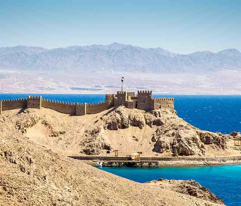 Taba, a resort town on the Red Sea, offering beautiful beaches, diving spots, and views of Jordan, Israel, and Saudi Arabia.