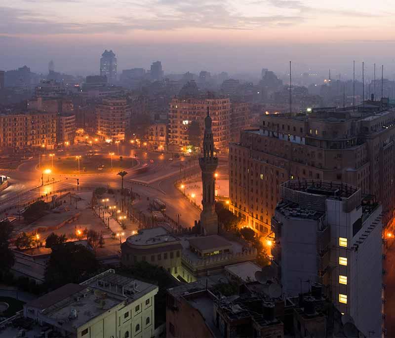 Tahrir Square, a central public square in Cairo known for its political significance and historic events.