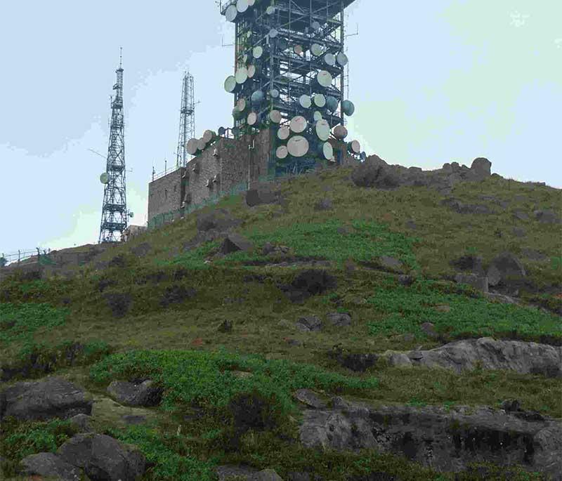 Tai Mo Shan, the highest peak in Hong Kong, offering panoramic views, hiking trails, and a serene natural environment.