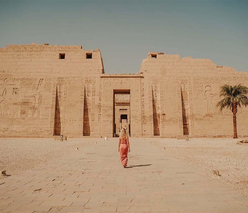 Temple of Medinet Habu, the mortuary temple of Ramesses III, known for its massive pylons and well-preserved military reliefs