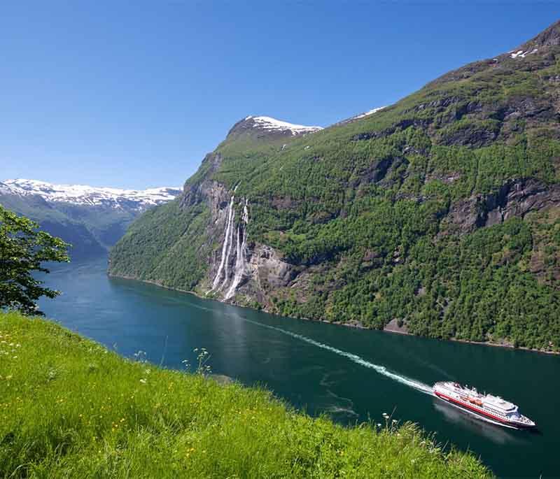Geiranger-Trollstigen National Tourist Route - A stunning drive with hairpin turns and breathtaking fjord views.