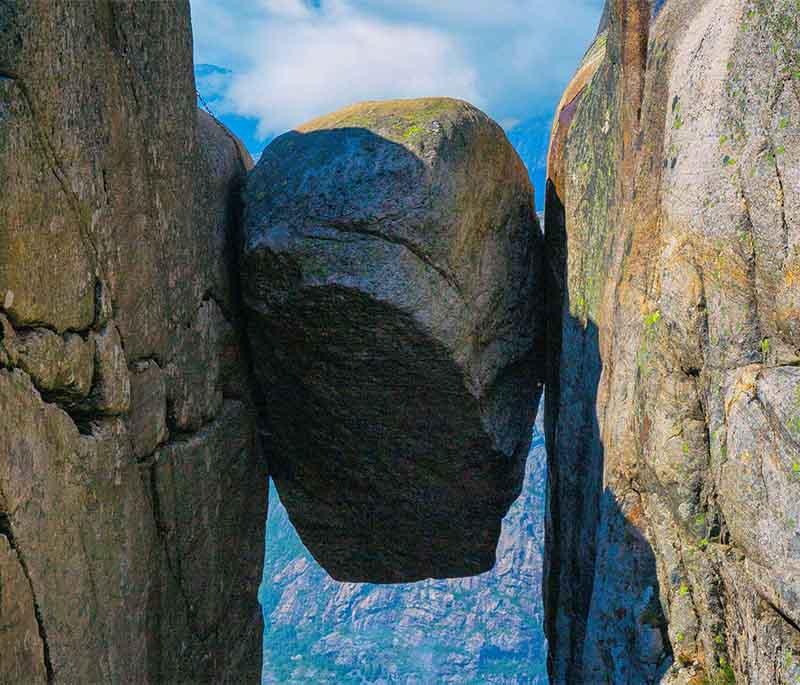 The Kjeragbolten Rock - A boulder wedged in a mountain crevasse, offering stunning views for adventurous hikers.