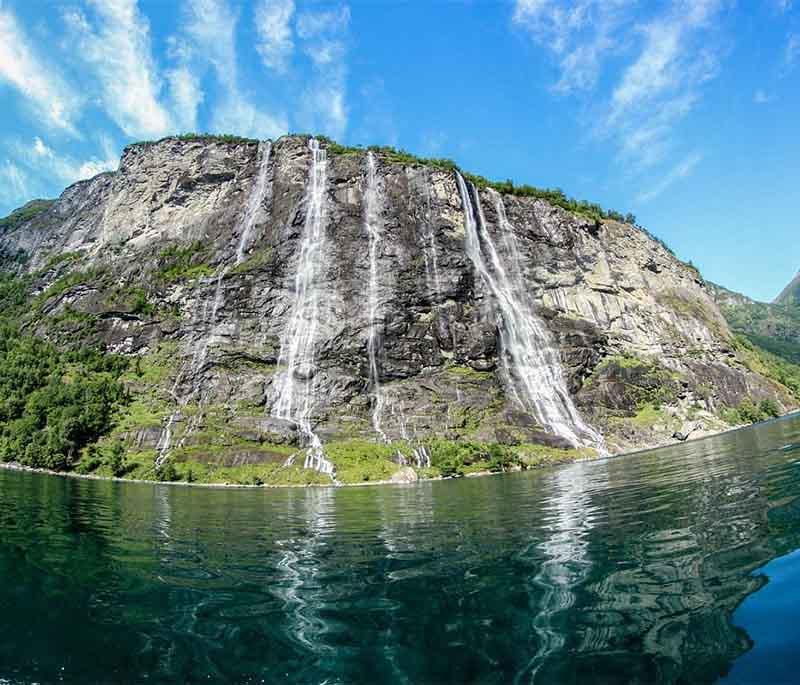 The Seven Sisters Waterfall - A series of seven waterfalls located in Geirangerfjord, known for their dramatic beauty.