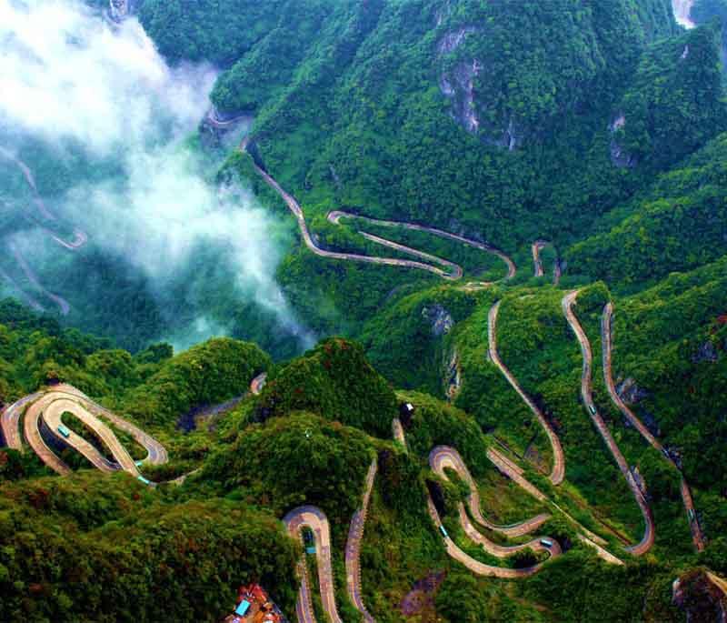 Tianmen Mountain in Hunan is famous for its natural arch, precipitous pathways along its cliffs, and scenic beauty.
