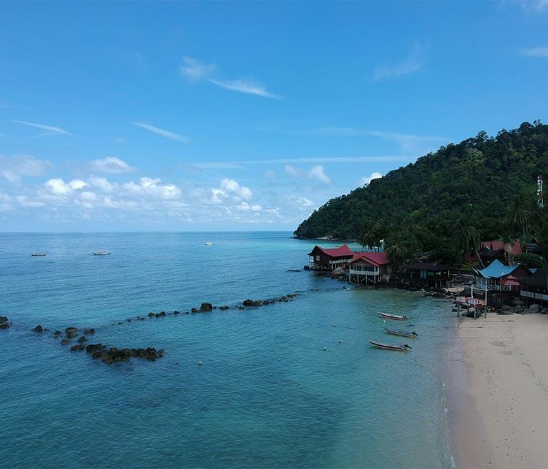 Tioman Island in Pahang is a serene getaway featuring pristine beaches, lush forests, and excellent diving spots.