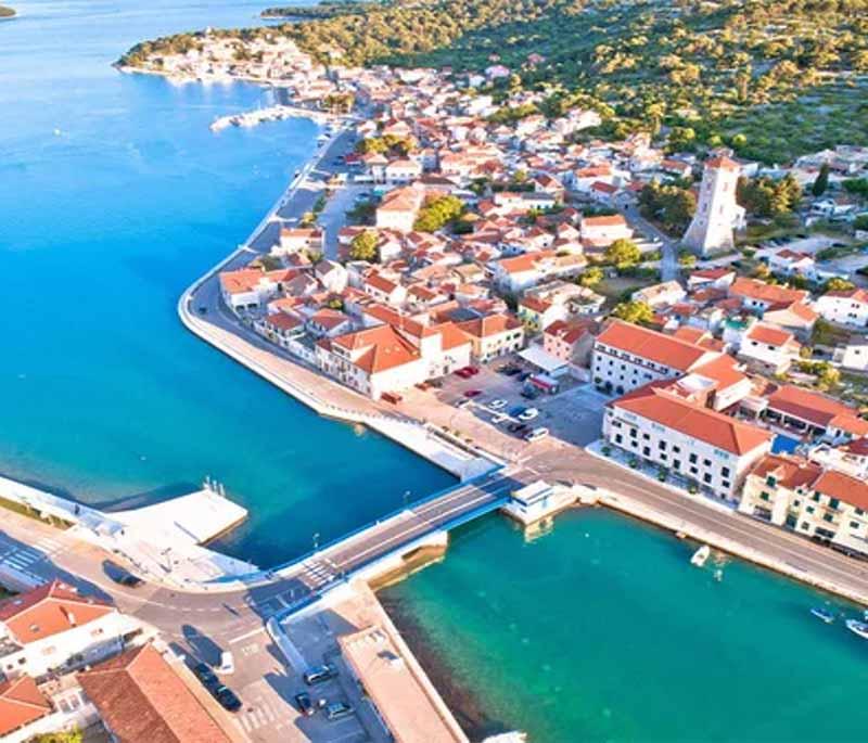 Tisno, a charming town located between the mainland and Murter Island, known for its beautiful scenery and music festivals.