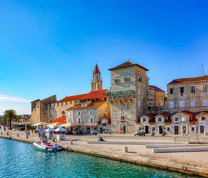 Trogir, a UNESCO site, known for its well-preserved old town, Romanesque and Gothic architecture, and scenic waterfront.