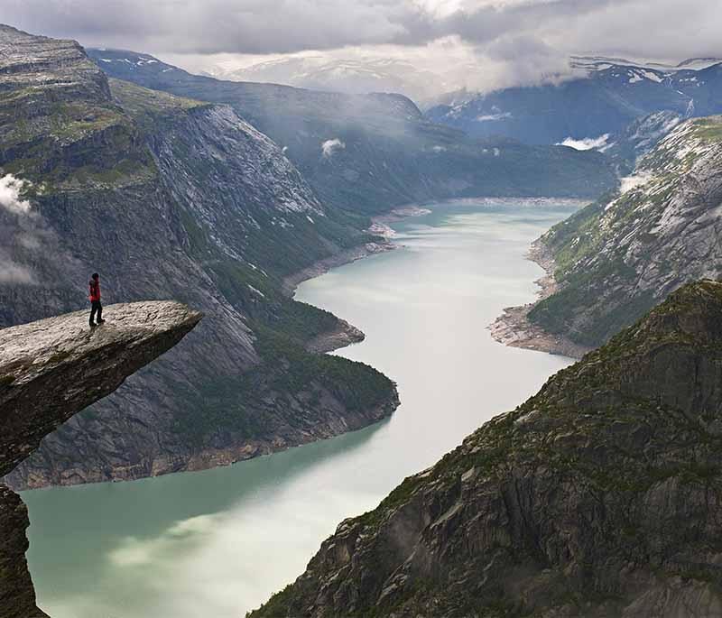 Trolltunga - A dramatic cliff rock jutting out over Lake Ringedalsvatnet, popular for hiking and photography.