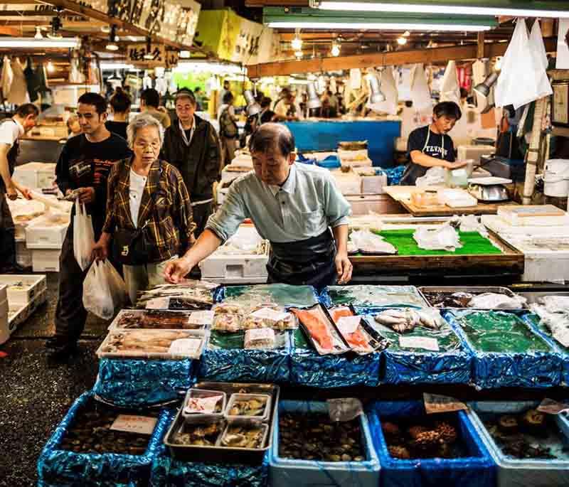 Tsukiji Fish Market, Tokyo, a famous market known for its fresh seafood, sushi restaurants, and lively atmosphere.