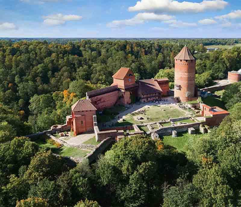 Turaida Castle, a medieval castle offering panoramic views of the Gauja River Valley and housing a museum.