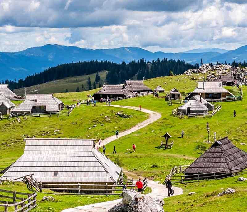 Velika Planina - A high-altitude alpine plateau known for its traditional herdsmen's huts and beautiful landscapes.