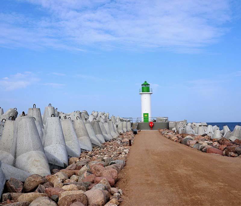 Ventspils Beach and Promenade, a family-friendly beach with a picturesque promenade, playgrounds, and sculptures.