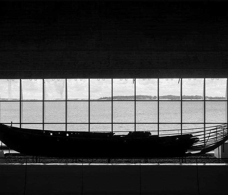 Viking Ship Museum, Roskilde, featuring well-preserved Viking ships and exhibits on maritime history by the Roskilde Fjord.