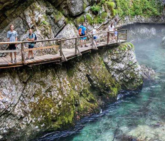 Vintgar Gorge - A beautiful gorge near Bled, featuring wooden walkways, waterfalls, and crystal-clear waters.