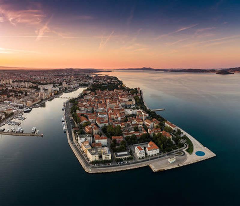 Zadar, known for its historic old town, Roman ruins, and unique attractions like the Sea Organ and Sun Salutation.