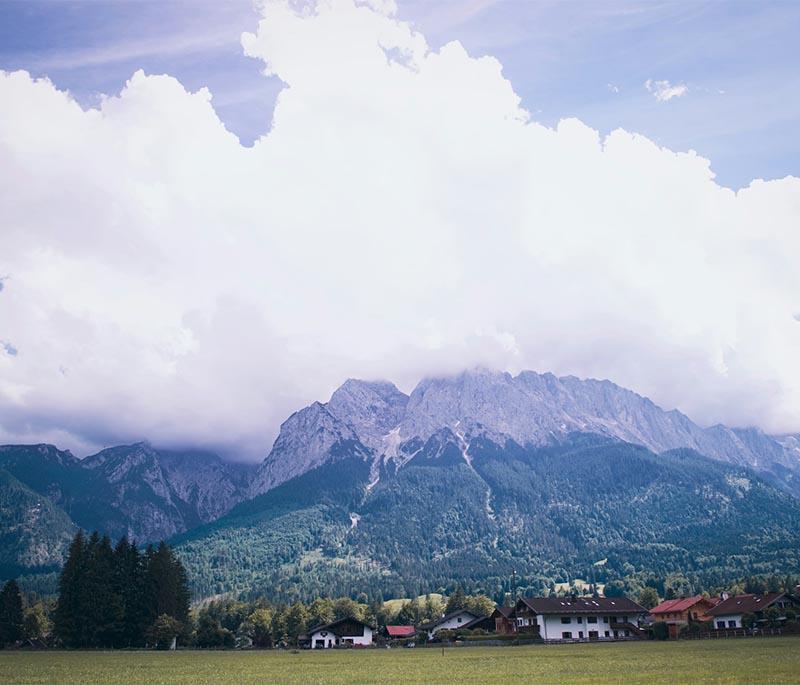 Zugspitze, Bavaria, Germany's highest peak, offering breathtaking views, skiing, and hiking opportunities.