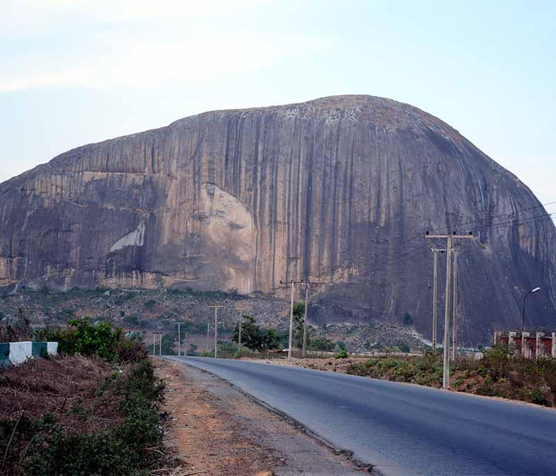 Zuma Rock - An iconic monolithic rock located in Niger State, known as the Gateway to Abuja, with striking presence.