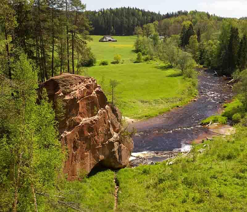 Zvartes Rock, a scenic sandstone cliff along the Amata River, popular for hiking and enjoying beautiful natural views.